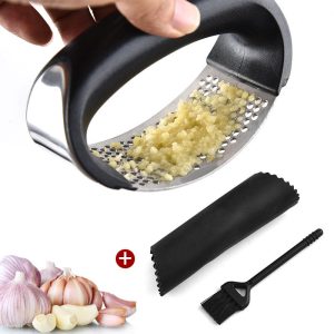 handheld garlic press a kitchen gadget