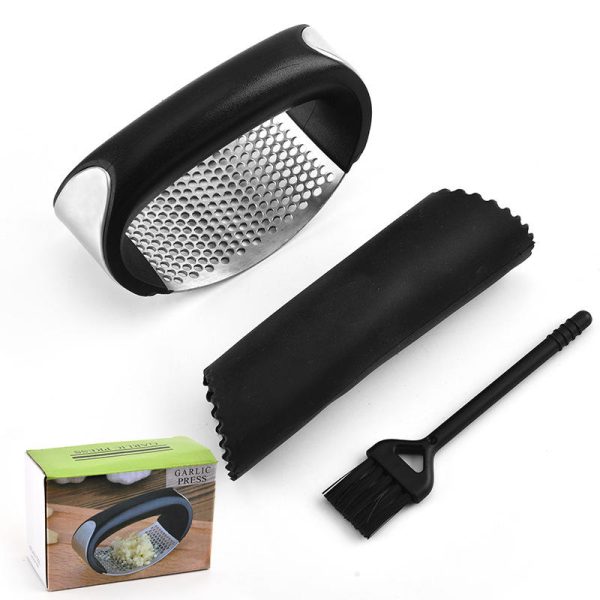 handheld garlic press a kitchen gadget