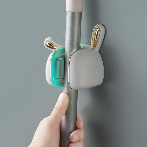 a cute and fun wall mounted rabbit ear mop hook without drilling holes