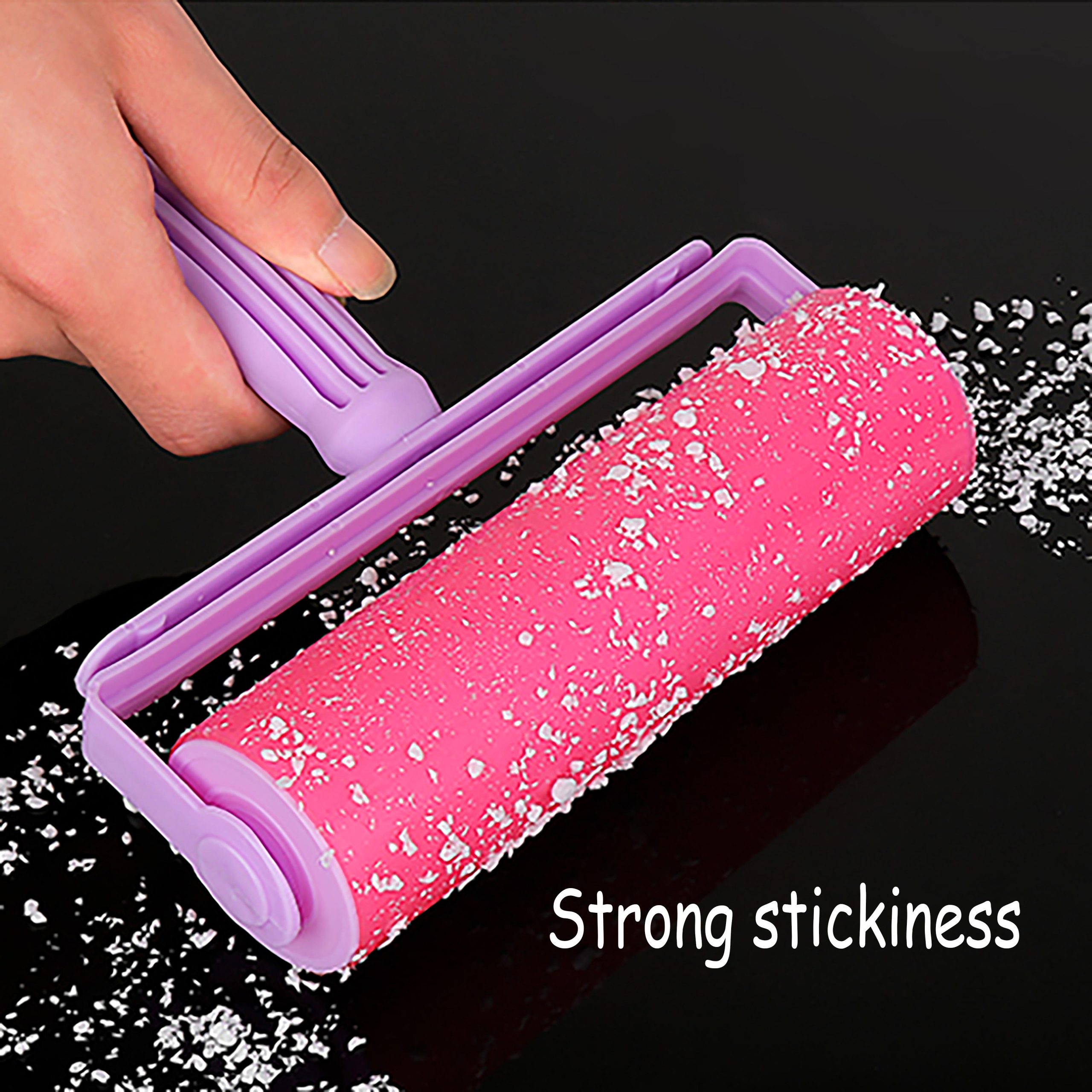 "purple handled powder cylinder" is a washable and reusable rubber bristle roller