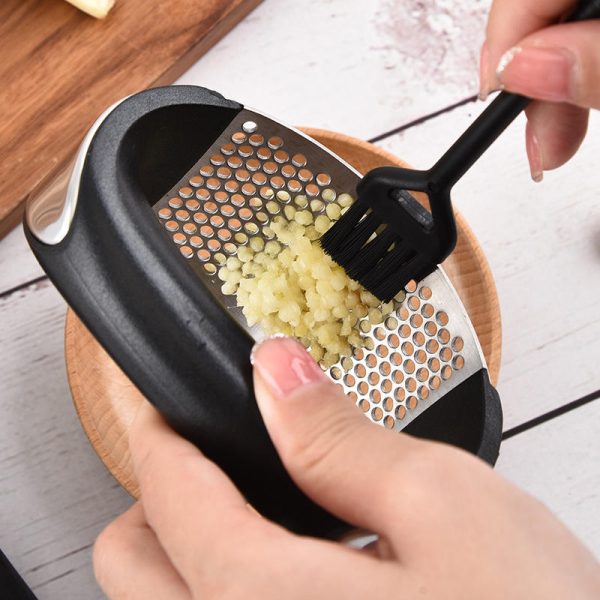 handheld garlic press a kitchen gadget