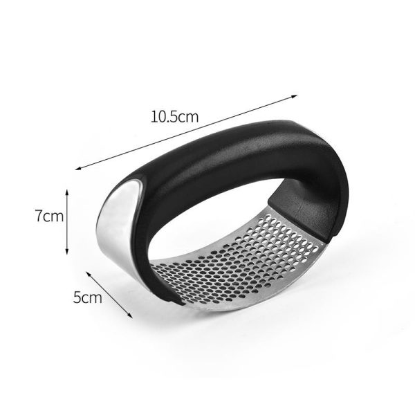 handheld garlic press a kitchen gadget